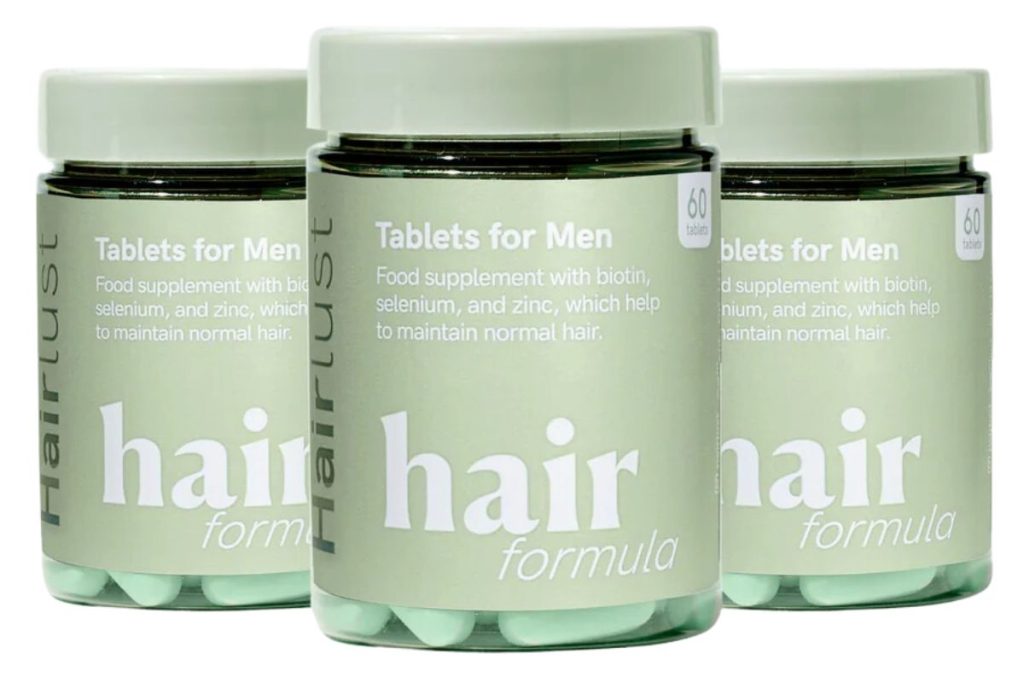 Tre bøtter af Hairlust Hair Formula Tablets for Men.