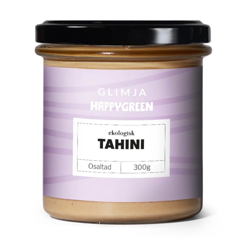 Et glas Glimja Happy Green Økologisk Tahini uden salt, 300 g.