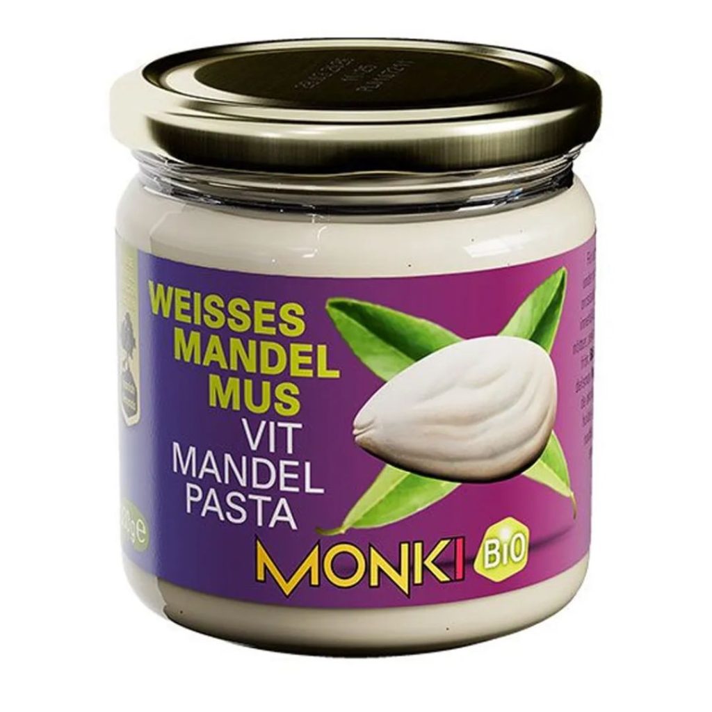 Glas Monki Mandelsmør Hvid med lys lilla etiket og guld låg.