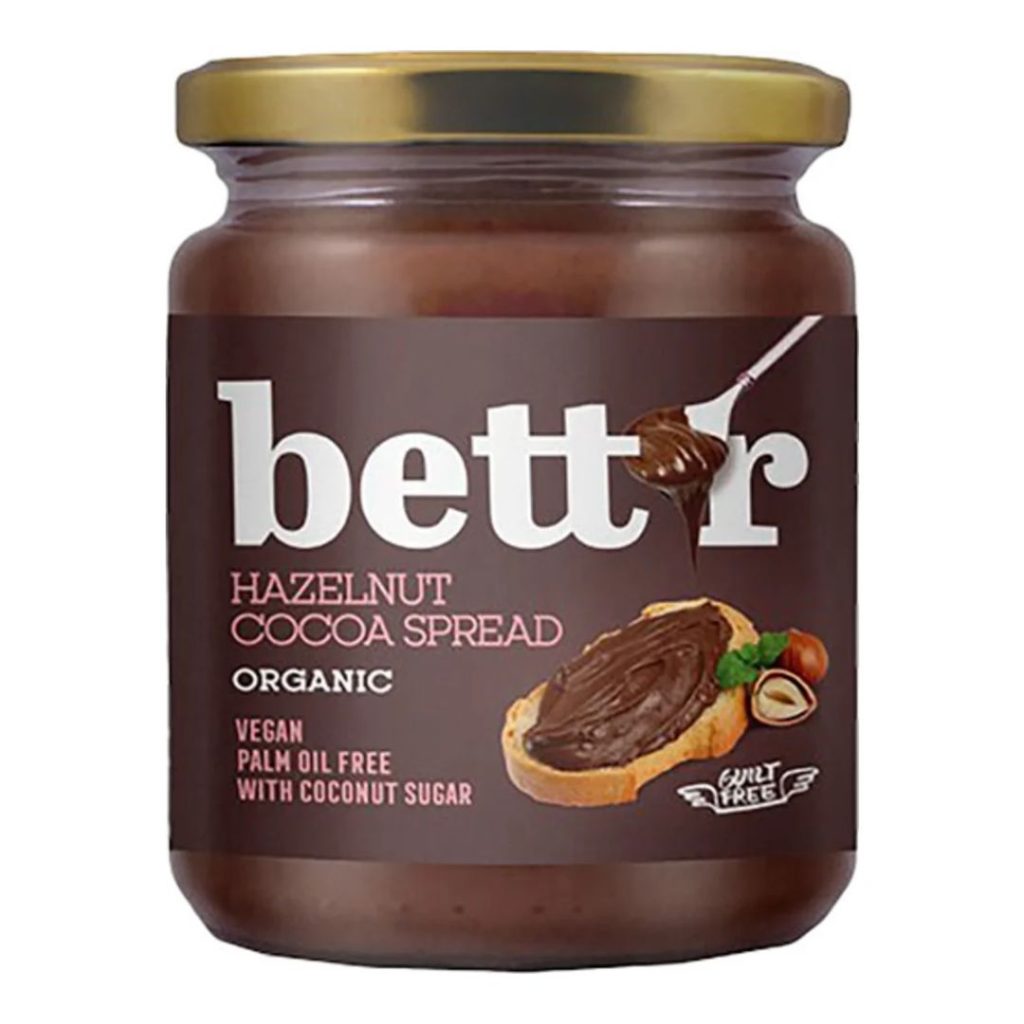 Glas med Bett'r Hazelnut Cocoa Spread med brun etiket og guld låg.