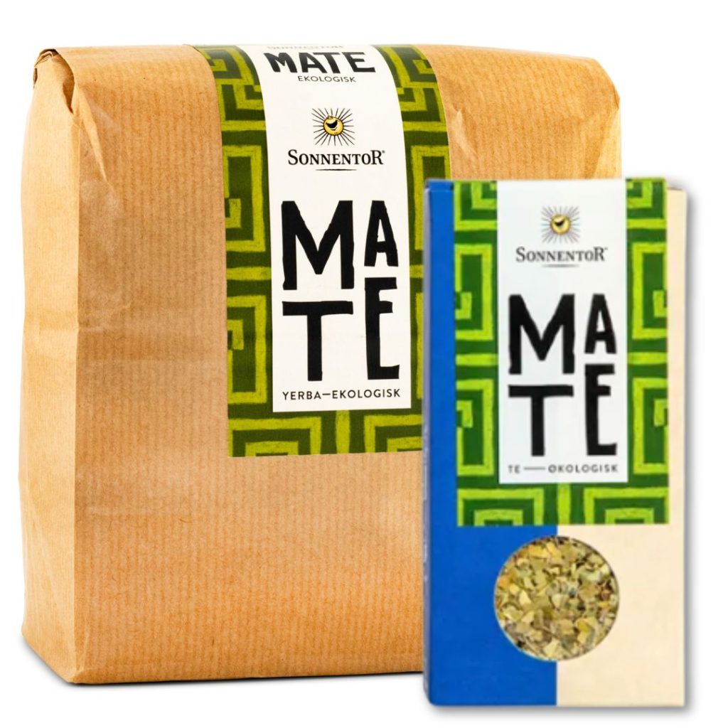 En brun papirpose med grøn grafik og en gennemsigtig sektion, der viser matebladene indeni.