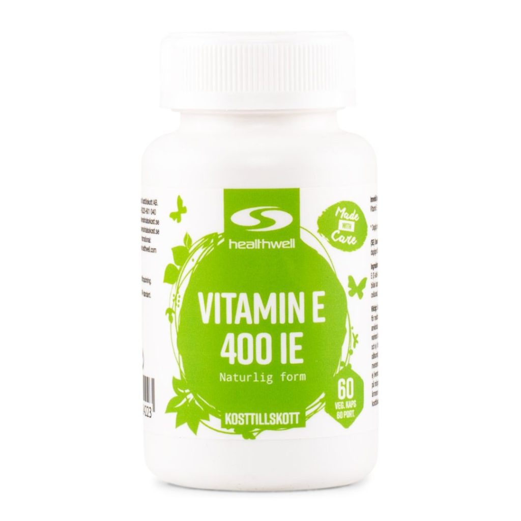 Hvid plastflaske med grøn etiket, der viser "Healthwell Vitamin E 400 IE".