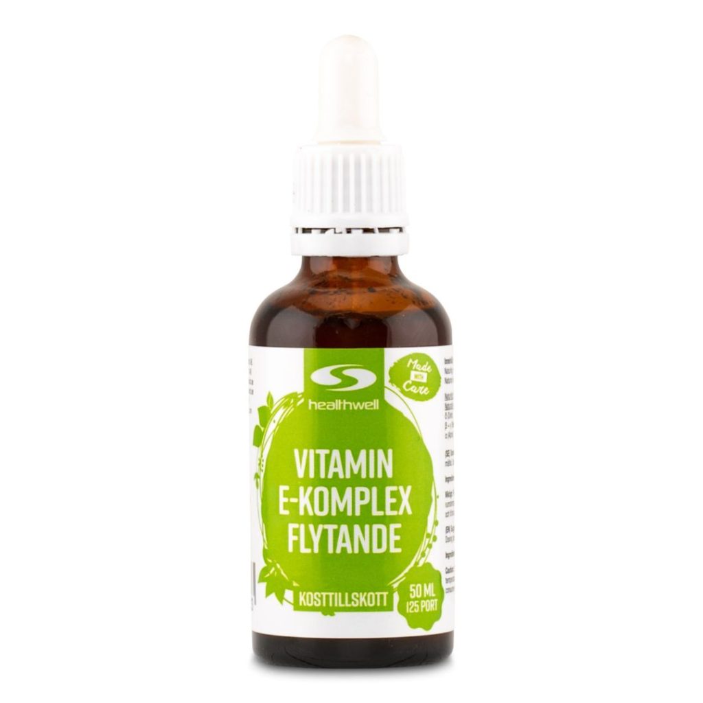 Brun glasflaske med pipette, der viser "Healthwell Vitamin E Komplex Flydende".