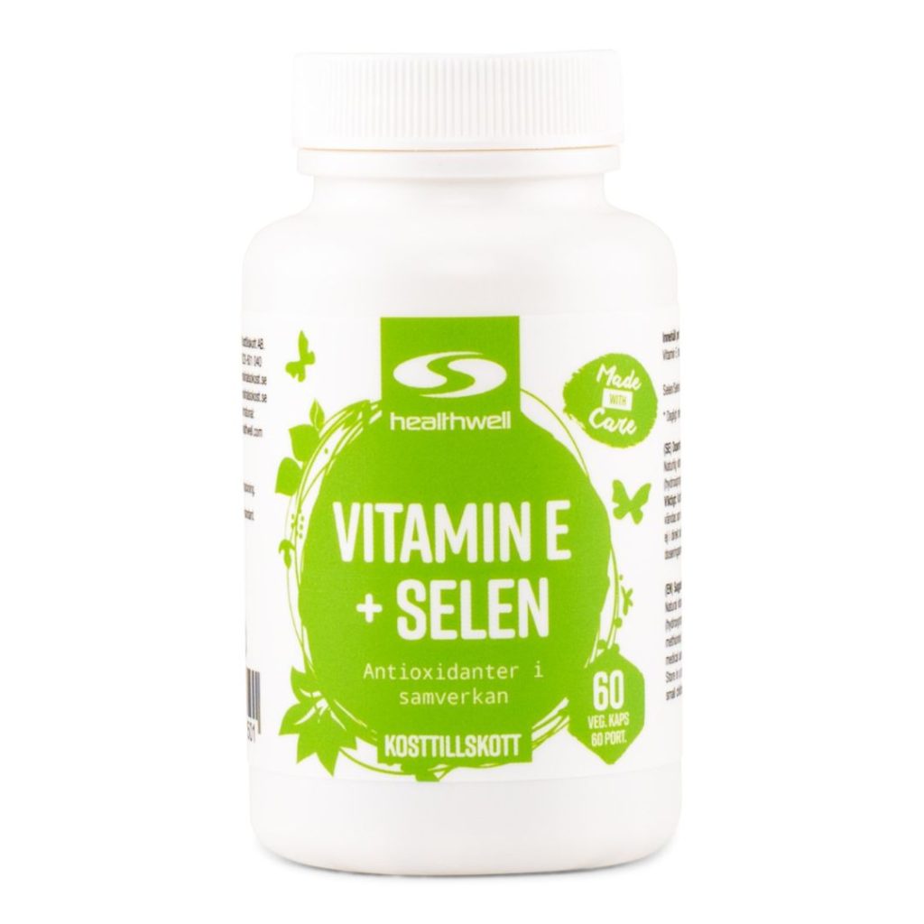 Hvid plastflaske med grøn etiket, der viser "Healthwell Vitamin E + Selen".